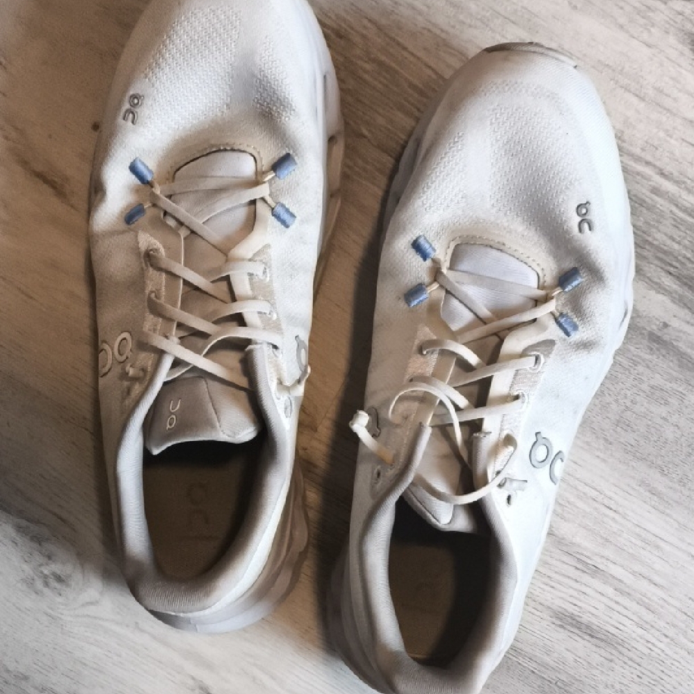 On Running White Shoes with Blue Highlights
